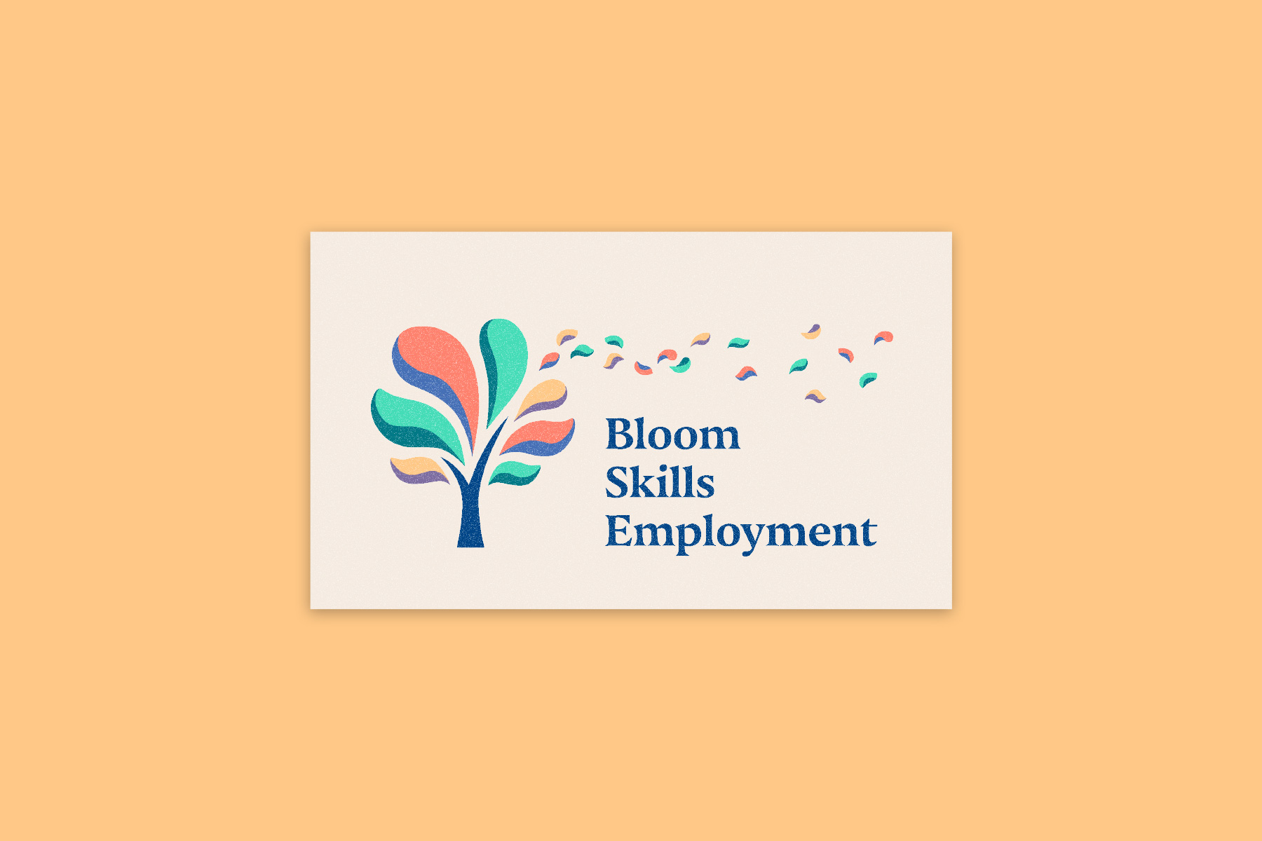 Bloom Skills Employment logo of an illustrated multi-coloured tree with small petals blossoming from it