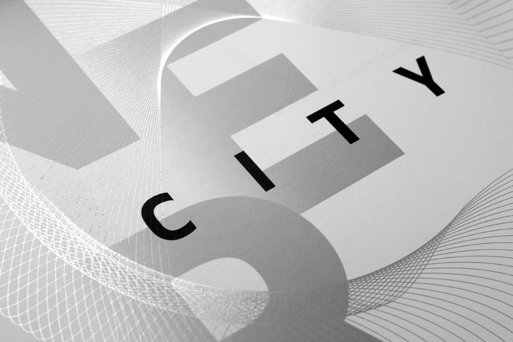 City of the Future title spread with bold spaced geometric sans typography that read's 'urban' with flowing silver lines running through it