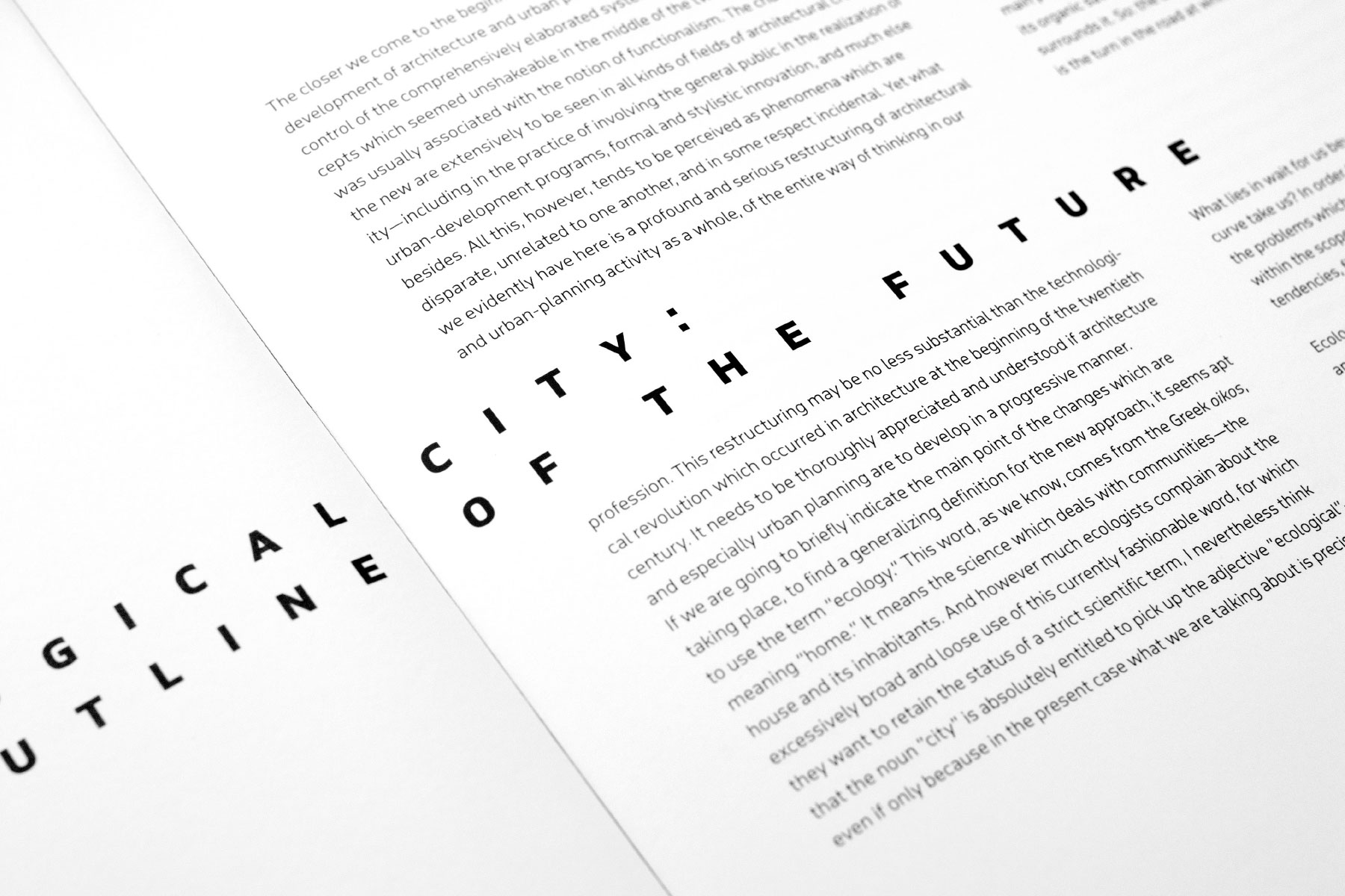 City of the Future book spread with bold spaced geometric sans typography splitting two blocks of body text