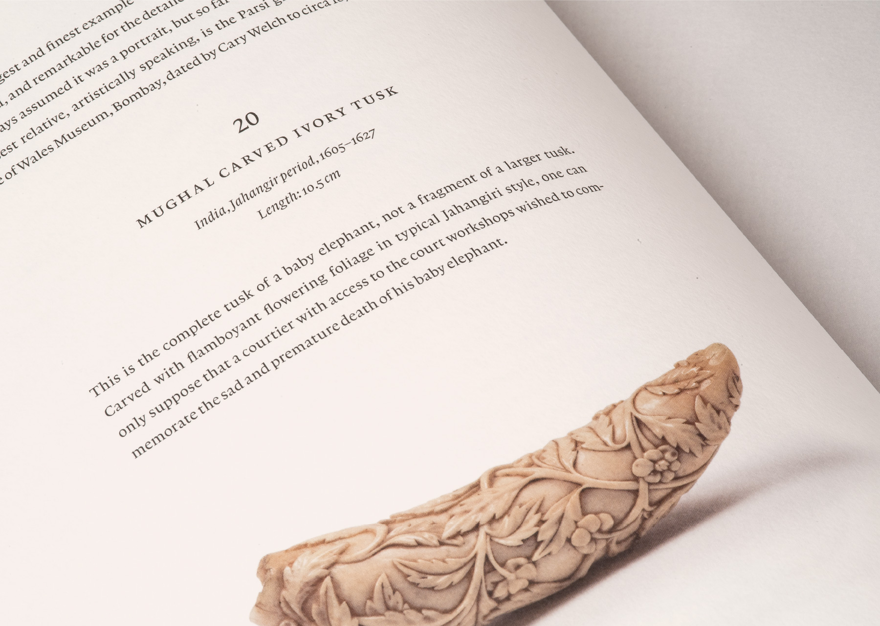 Close-up of catalogue spread showing a Mughal carved ivory tusk